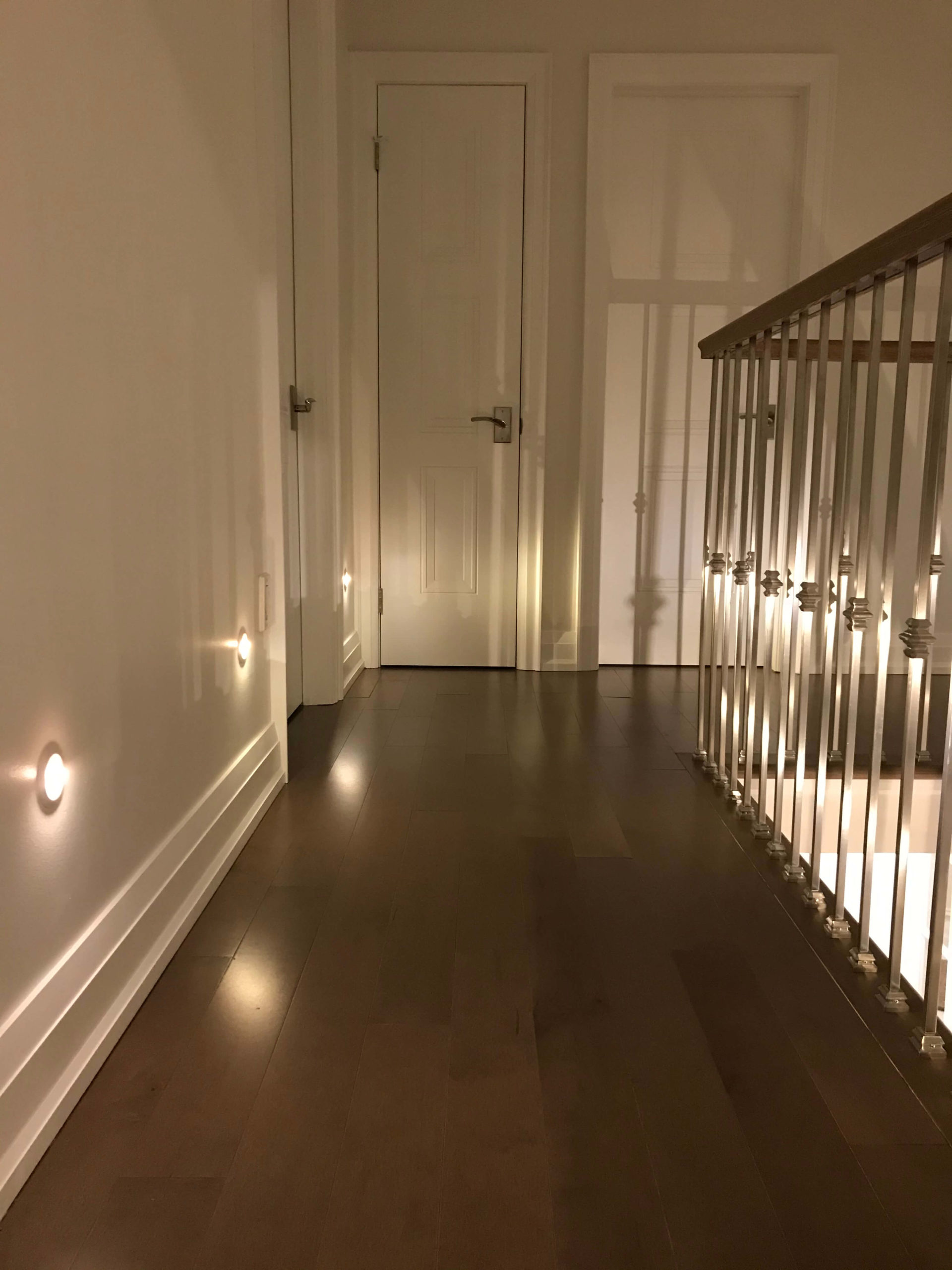 Hallway with round recessed stair lights