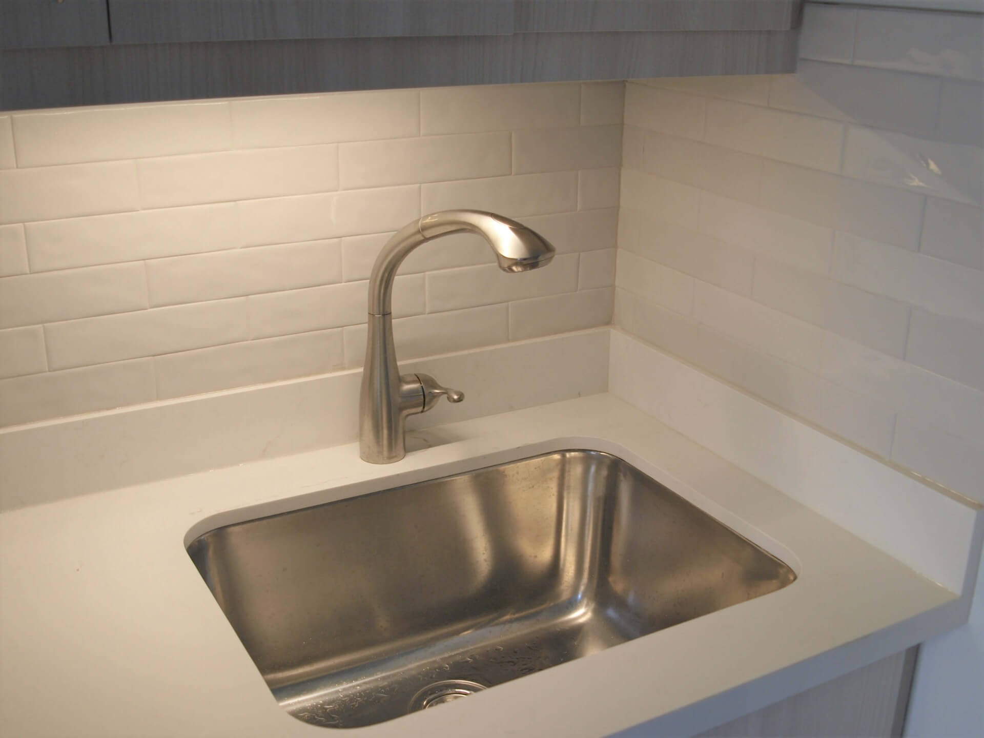 Laundry room LED task lighting below wall cabinets