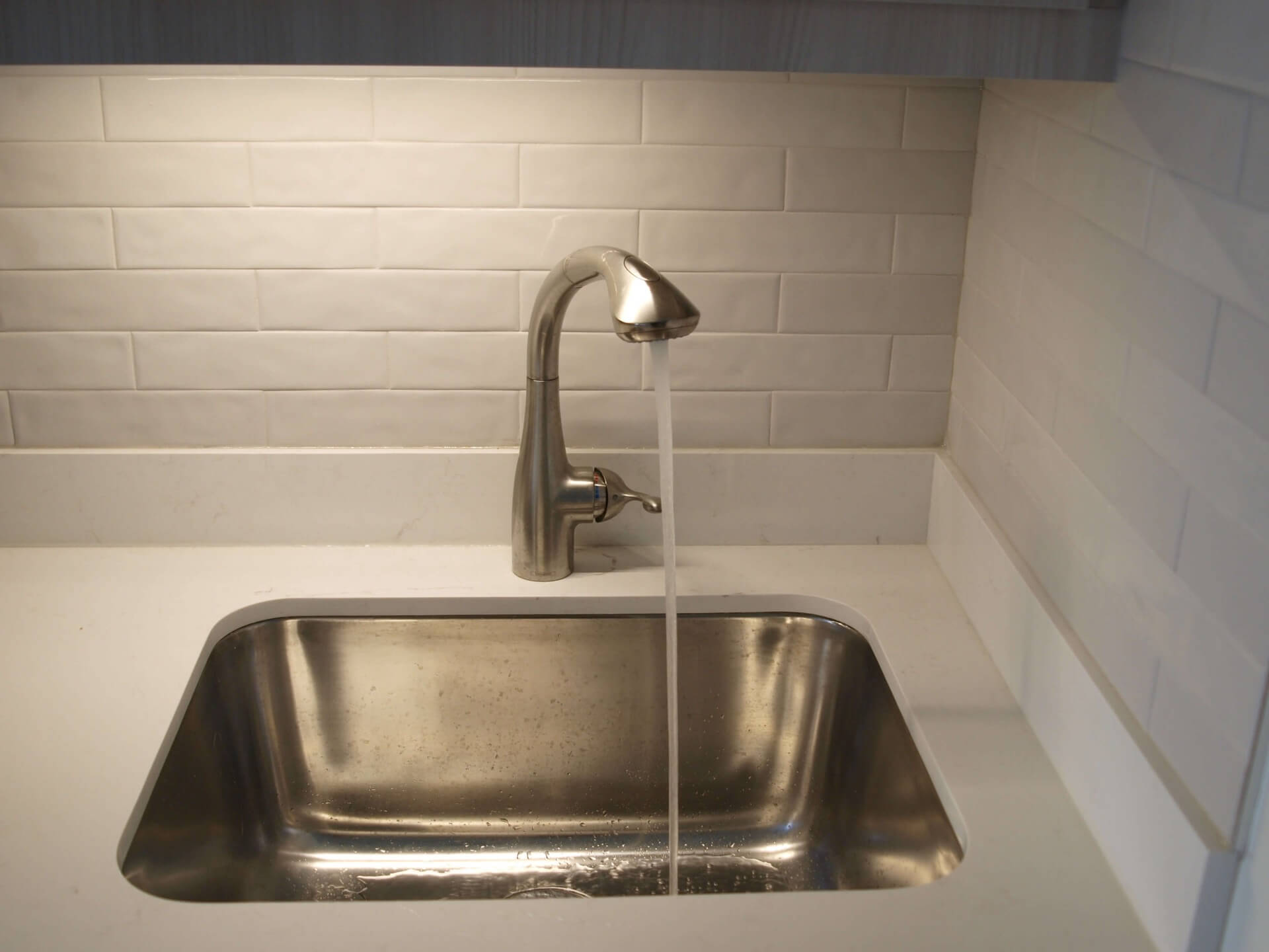 Laundry room under-cabinet lighting above a work surface