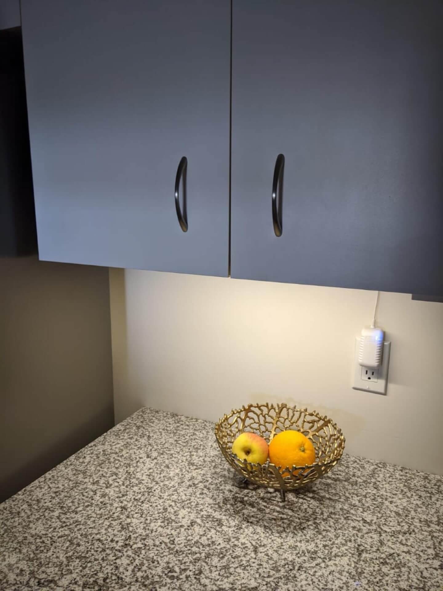 Modern kitchen under-cabinet lighting installed below upper cabinets