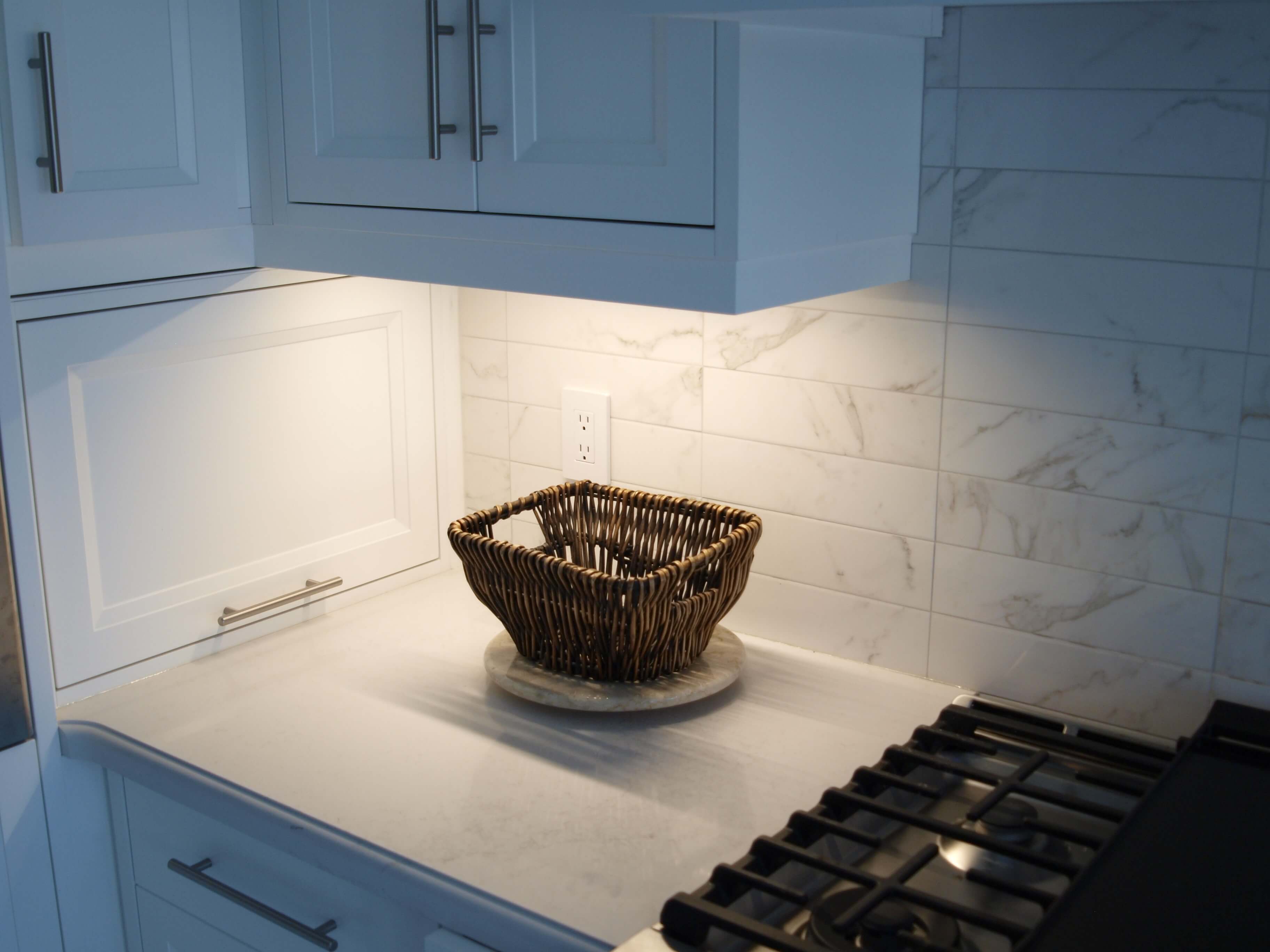 Under-cabinet linear LED lighting installed in a renovated kitchen