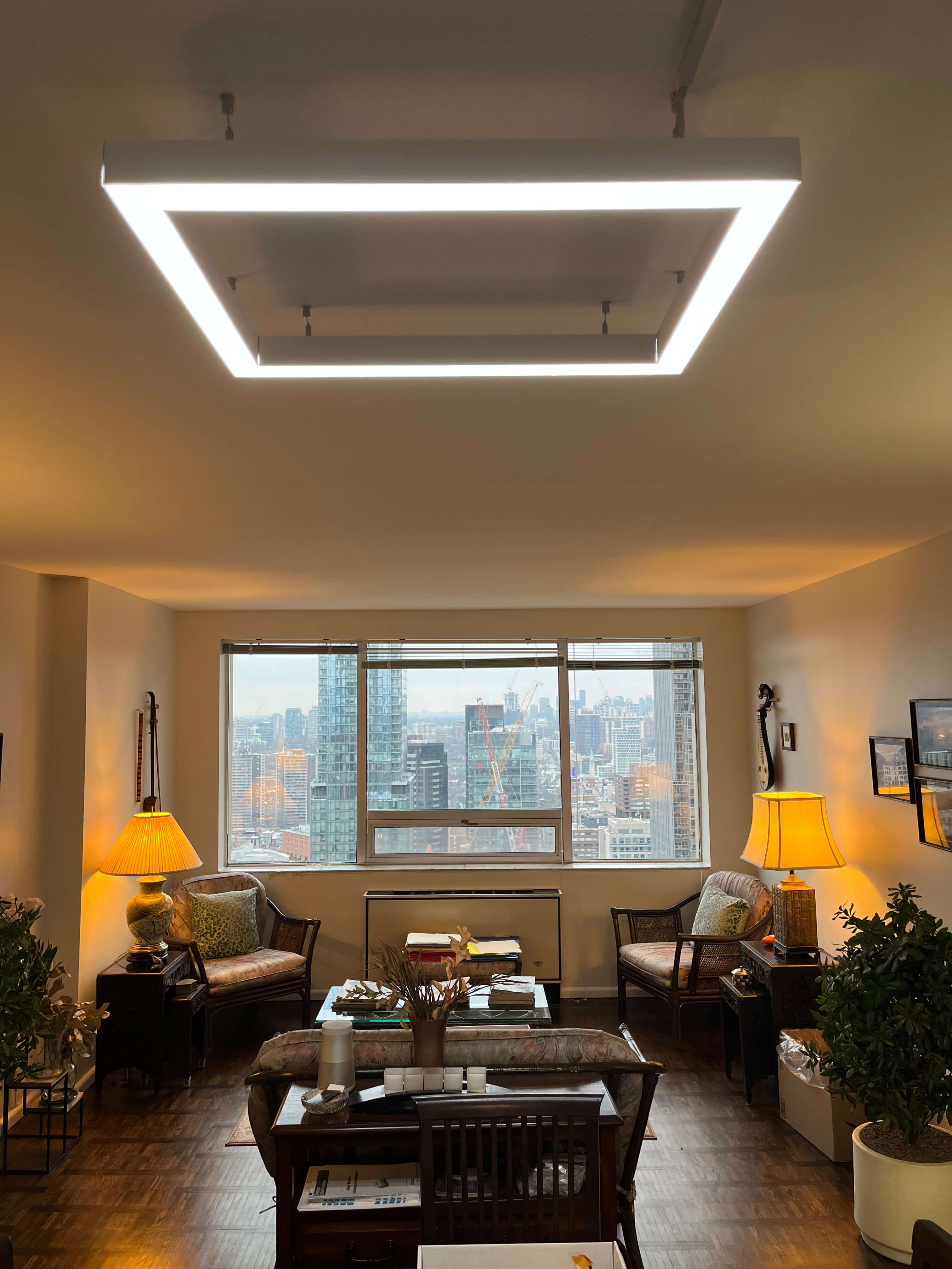 Custom dimmable LED ceiling fixture in a high-rise residential space