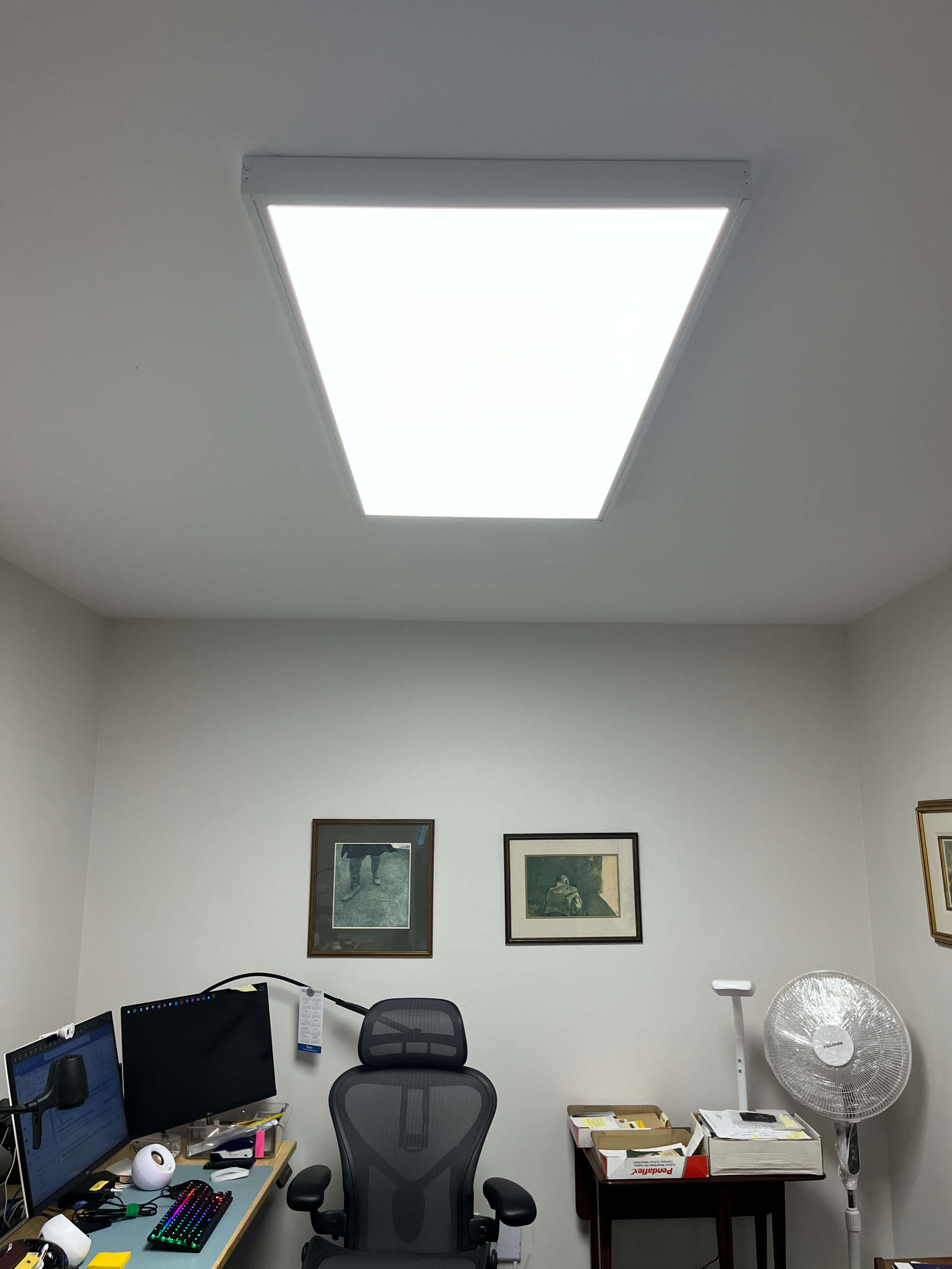 Close view of a custom dimmable LED panel above a home office desk