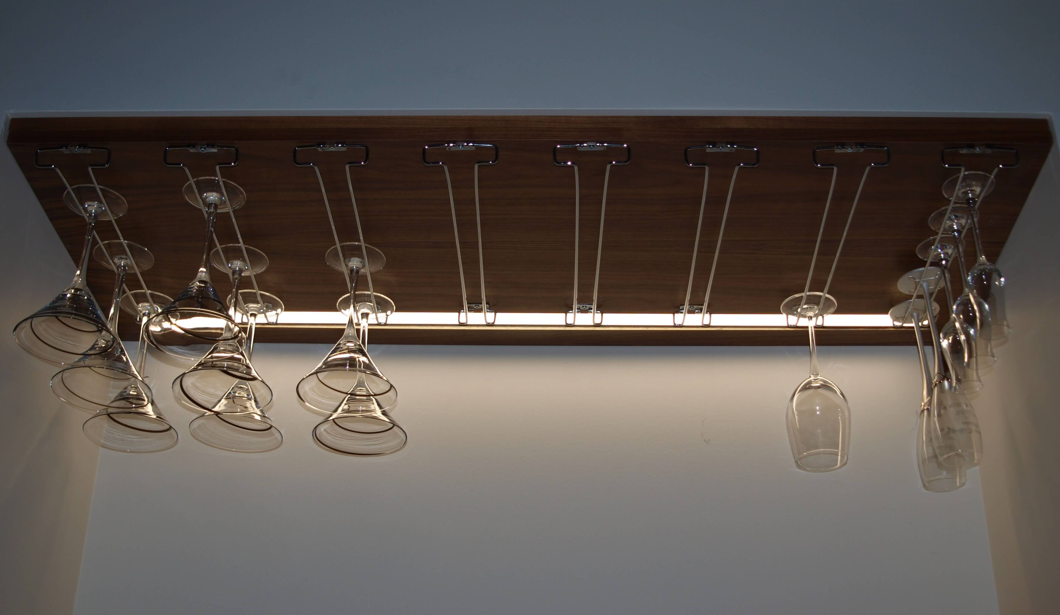 Bar shelf lighting detail with glassware