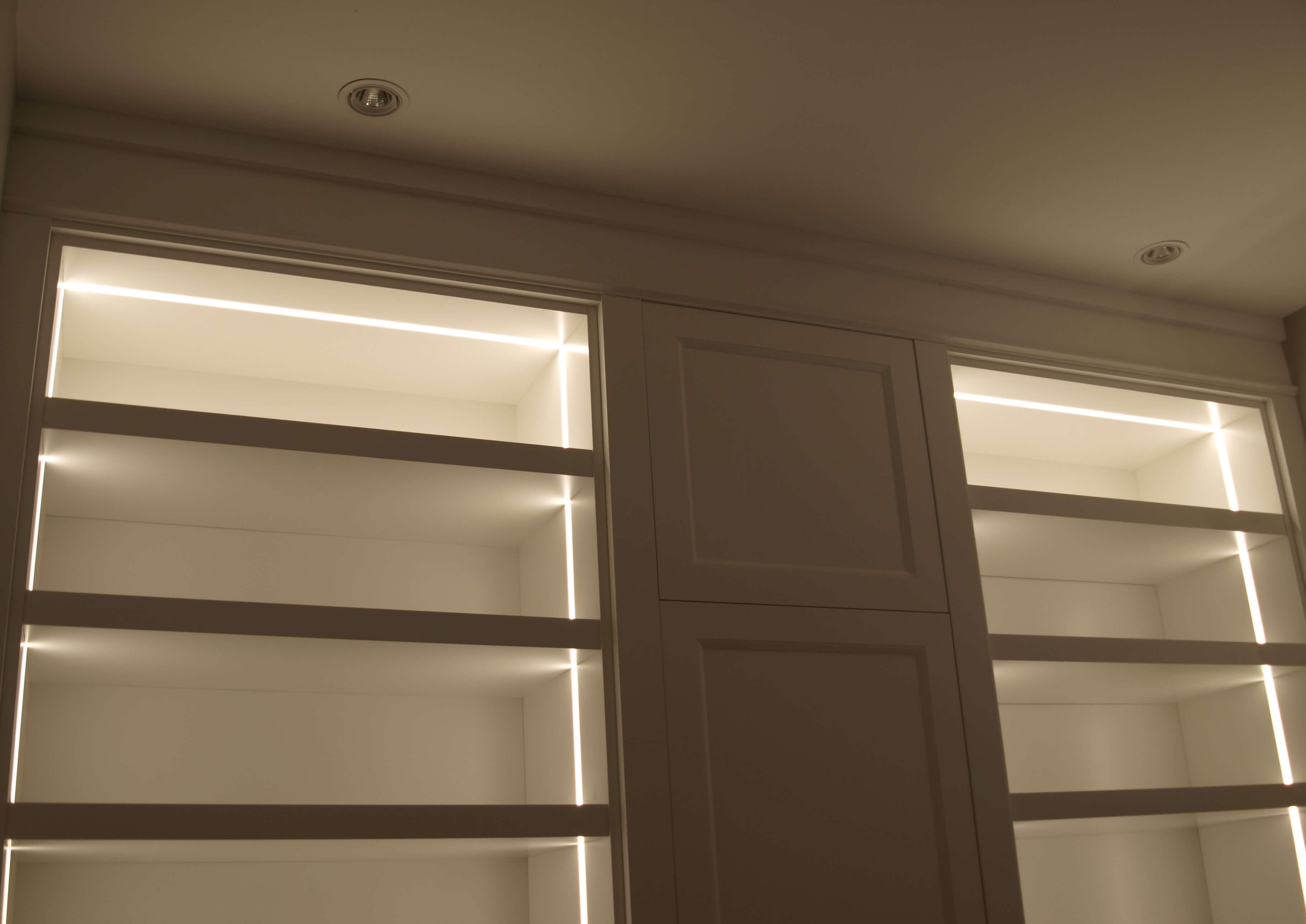 Custom millwork shelf lighting detail