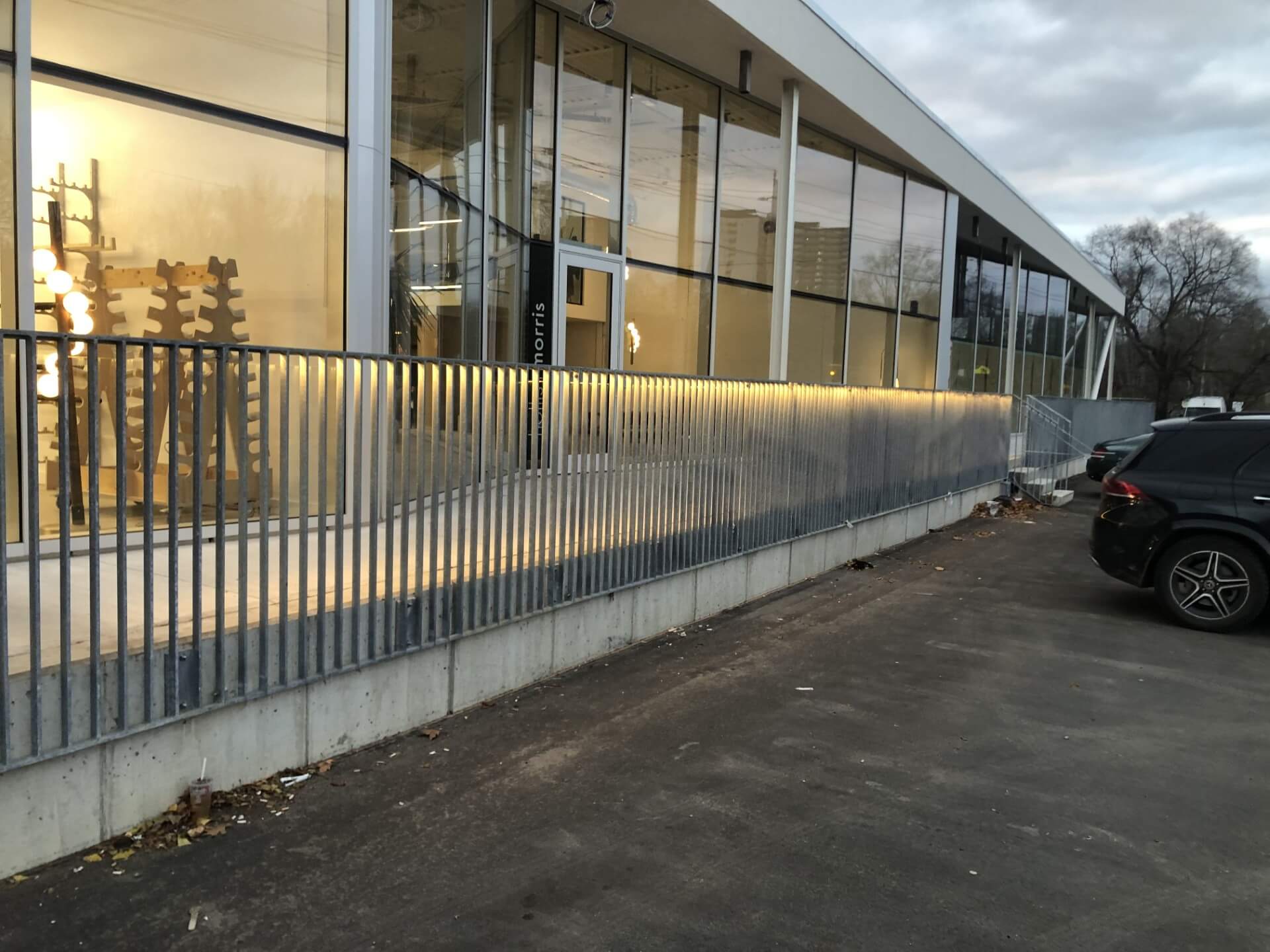 Commercial building with custom linear LED lighting integrated under the outdoor handrail